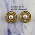 Detail of matte gold baroque pearl earrings showing 1.9cm diameter and 5.8g weight - 0334/Gold Concentric Circles Pearl Studs