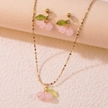 Elegant cherry jewelry set with pink bead fruits and gold chain on a minimalist pedestal - Necklace and Earring Set / Pink