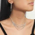 Silver teardrop necklace and tassel earrings set with white rhinestones worn by model - Multi-Layer Tassel Rhinestone Set (DTN14026657S)