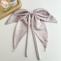 Elegant lavender satin bow hair clip featuring silk texture and pearl charms - Ribbon Pearl Bow Hair Clip / Taro Purple