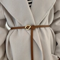 Caramel brown leather waist belt with gold geometric buckle on a beige wool coat - Brown
