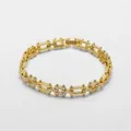 Detailed close-up of 18k gold plated bracelet with pave-set white zircon link patterns - Golden Pave Zirconia Hollow Link Chain Style