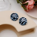 Chic round zebra pattern stud earrings in black and white on a display stand - Zebra Print