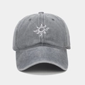 Close-up of vintage sun embroidery detail on washed grey cotton baseball cap texture - Adjustable / Gray