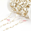 Golden stainless steel chain featuring 10mm and 6mm white leaf beads on a spool - Stone Teardrop Leaf Style (F2335) / 6x10mm / Gold