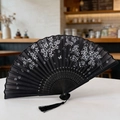 Classic black folding fan with white flowers, butterfly pattern and matching silk tassel - Style 29 (New Style)