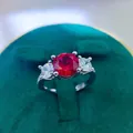 Detailed macro view of 2 carat round red ruby ring set in a luxury velvet jewelry box - A2 Open Type / Red