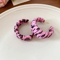 Pink leopard print C-shaped hoop earrings with silver pins on a white ceramic plate - Silver Earring Post - Pink