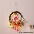 Christmas wreath with Santa Feliz Navidad sign, pine needles, berries and LED lights - 45cm Rattan Wreath with LED
