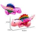 Pink cartoon dinosaur wind-up car toy with colorful fins, measuring 8.2cm by 4.3cm - Style C - Pink Crested Dinosaur (8.2x3.5x4.3cm)