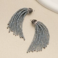 Detail of grey beaded tassel charms with rhinestone caps and small rings for jewelry DIY - Teal