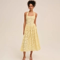 Detail of yellow lace halter neck midi dress featuring a cinched waist and A-line skirt - S / Yellow