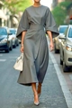 Close-up of elegant dark grey midi dress featuring dramatic bell sleeves and slim waistline - S / Gray