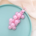 Pink grape pendant keychain made of pearlescent resin on a light blue ceramic plate - Charm / Pink