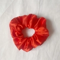 Elegant large red satin scrunchie with silky finish and elastic texture for women - Red