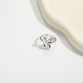 Minimalist silver adjustable open ring with polished flower design on a clean white backdrop - Letter K Style