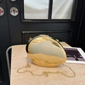 Elegant gold oval hard shell acrylic clutch bag with shiny metal finish and chain strap - Gold