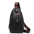 Detail showing high-quality leather texture and metallic zippers on this men's chest bag - Black