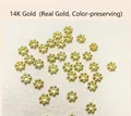 Detailed macro view of 18k gold plated snowflake spacer beads for jewelry making - 4mm Hole 1.2mm / 14K Gold Plated
