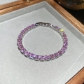 Detail of pink zircon tennis bracelet with silver clasp and secure prong setting - Silver-Pink