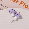 Close-up of handmade purple glass mushroom beads with blue polka dots for DIY jewelry - No.7 (Light Purple Cap Blue Dot White Stem)