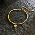 Detail of 18K gold-plated titanium steel bracelet with textured beads and heart charm - Sparkling Heart Pendant / Gold