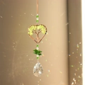 Detail of tree of life heart suncatcher showing green peridot stones and crystal pendant - Peridot Green Heart