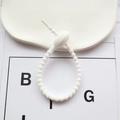 Adjustable white silicone cable organizer tie with non-slip tooth structure for desk - White