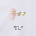 Macro shot of 8x8mm peach-shaped alloy nail art charms with gold finish and green leaves - Gold Green Leaf Peach (Gold Base) (8345)