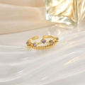 Detail of a golden crown ring featuring five purple gemstones on a white silk background - Purple Round Stone Crown (JZ0137)