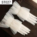 Detailed close-up of white tulle wedding gloves featuring elegant pearl wrist embellishments - Lightweight Mesh Pearl Ruffles (ST027)