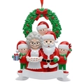 Detailed resin Christmas ornament featuring Santa and children with a green wreath - 5-Person Family