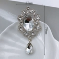 Silver crystal flower charm with oval center and teardrop pendant, size 37mm x 76mm - Silver Base White Pendant