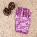Elegant long purple lace gloves with rose patterns laid on a soft plush beige rug - One Size / 22cm Purple