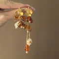 Retro amberkleurige hars oorbellen met gouden bloemknopjes en lange kwastjes - 3# Zilveren naald-Koffiegoud