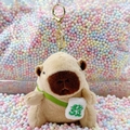Plush capybara keychain toy with a white fortune bag accessory and golden clasp - Light Brown Green Fortune + Gold Clip