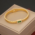 Macro detail of gold stainless steel bracelet featuring green gemstones and cubic zirconia - Cuban Chain Triple Stone Style (6#)