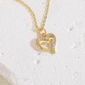 Elegante goldene Doppelhalskette mit Herzanhänger und funkelnden Zirkoniasteinen - Doppelherz / 14K Gold