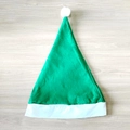 Classic green felt Santa hat with white fur trim and pompom on a rustic wood surface - Ordinary Non-woven Adult Style (30x40cm) / Green