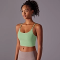 Close-up of thin straps and U-neck detail on a light green seamless yoga sports bra - S / Tops / Vesta Green