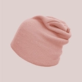 Close-up of soft dusty pink knitted beanie showing refined texture and slouchy design - Dusky Pink
