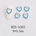 Macro shot of silver heart nail charms with blue rhinestones and bow detail, 9x9.5mm - Bow Decor Heart Style(A365)