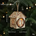 Hanging wooden Christmas house ornament with warm LED lights and XMAS laser cutouts - Wooden House Warm Light Style C