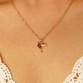 Exquisite gold hummingbird pendant necklace with red heart stone on a female model - Red Heart Green Zircon Hummingbird Necklace-KC Gold (36)
