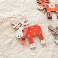 Set of colorful wooden Christmas reindeer ornaments with ribbons on white plush background - Red