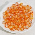 Macro shot of 6mm-8mm orange crackle glass beads in a white shell dish for DIY jewelry - 8mm / Orange