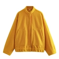 Close-up of yellow fleece jacket texture with stand collar and size S tag detail - Yellow