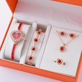 Detailed view of a 5-piece gold jewelry gift set with red heart-shaped stones and a watch - Gold Red Heart Gem Set (8)