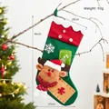 Green knit Christmas stocking with reindeer plush and rustic buttons on a pine tree - 3-Button Reindeer Stocking