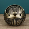 Bronze spherical metal ashtray with rotating lid featuring embossed Dubai landmarks - Bronze Dubai Small